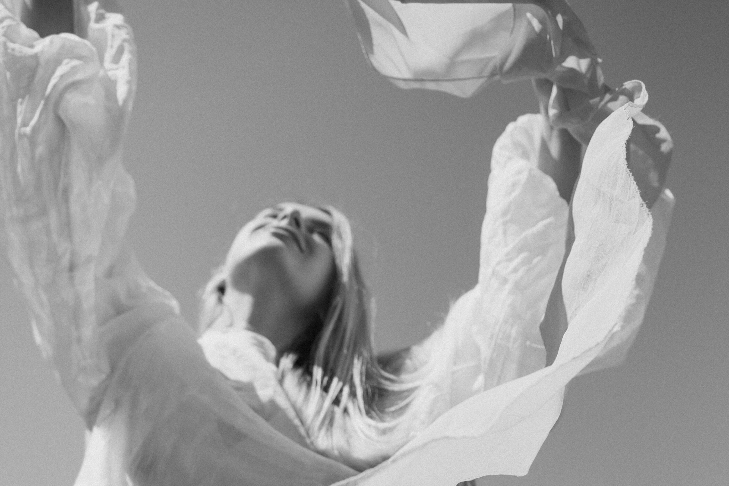 woman with fabric in the wind