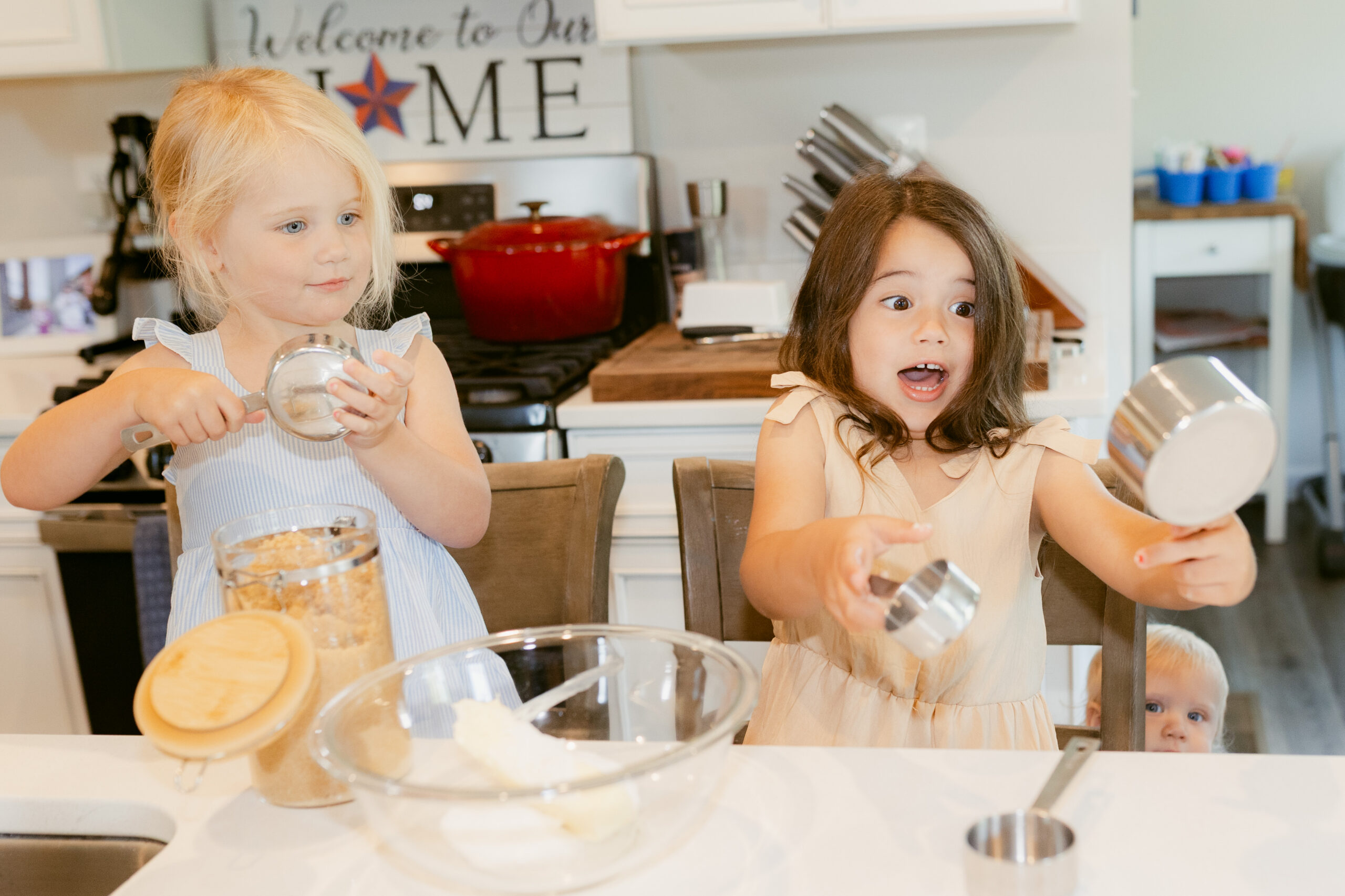 maxann keller creative family session with young girls baking cookies.