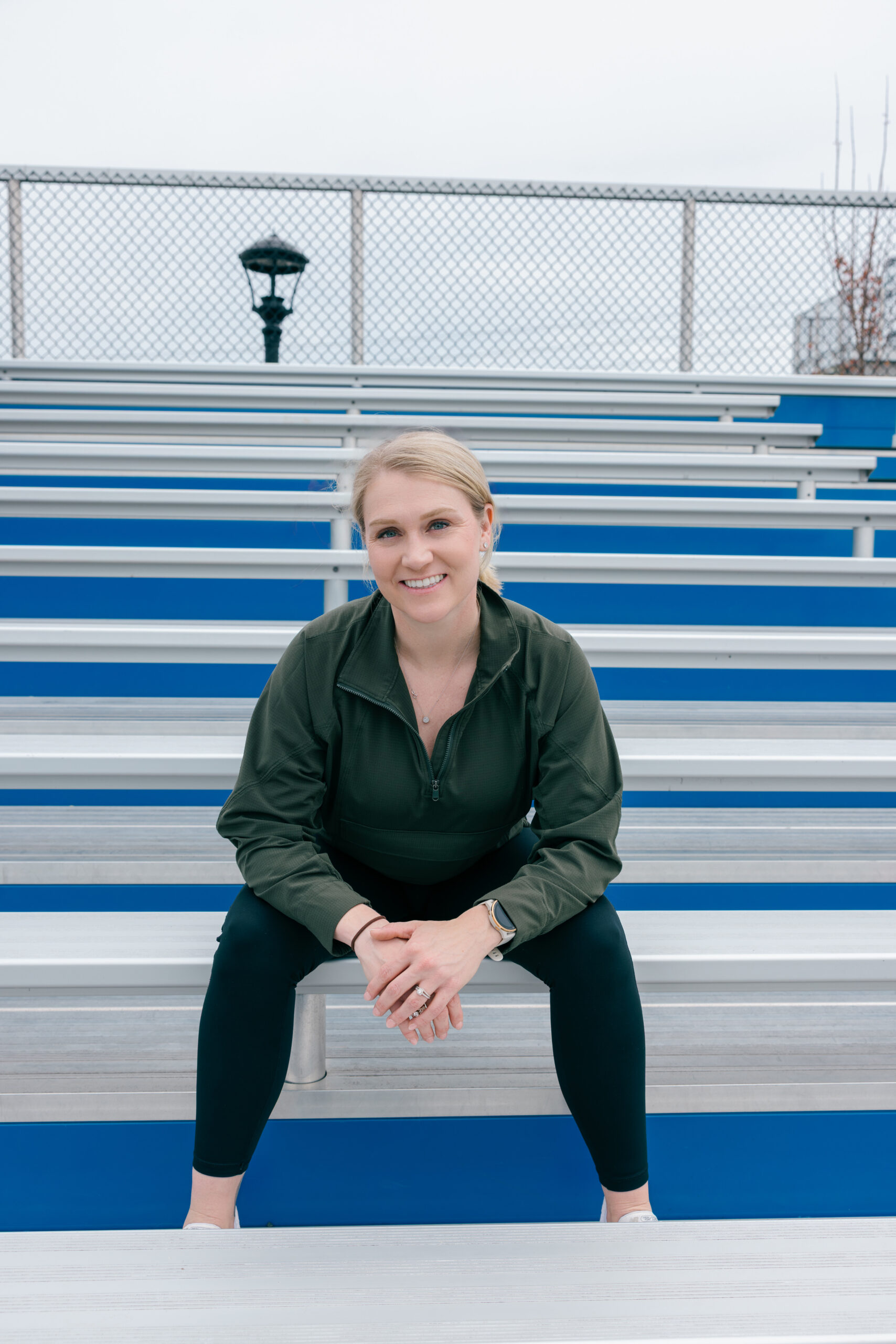 Active lifestyle enthusiast and writer Maxann Lockard on the steps in workout gear